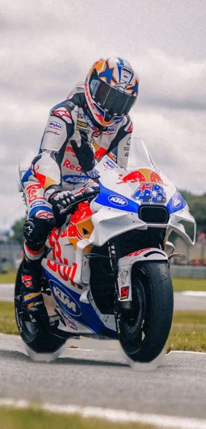 Motorcycle racer on track in a dynamic pose with a blue and white bike.