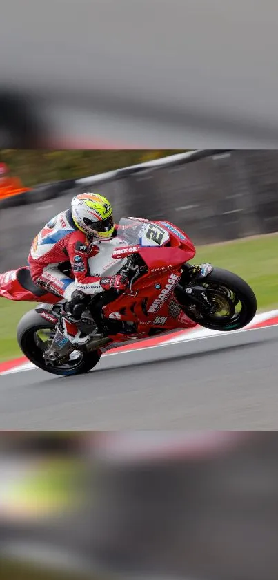 Motorcycle racing on track with vibrant red color.