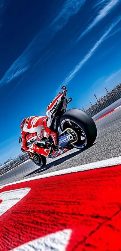 Motorcycle racing on vibrant track with blue sky