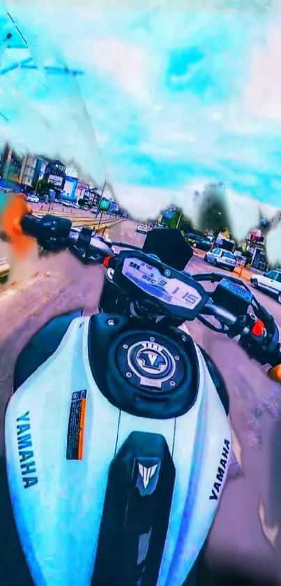 Motorcycle ride view with cityscape and vibrant sky.