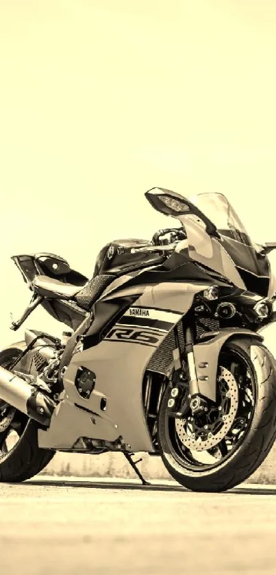 Sepia-toned motorcycle on open road, dynamic and sleek design.