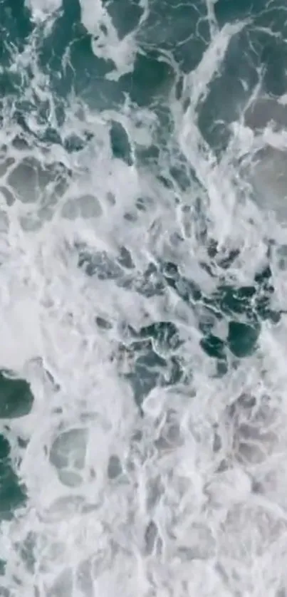 A breathtaking view of ocean waves with foamy sea and turquoise water.