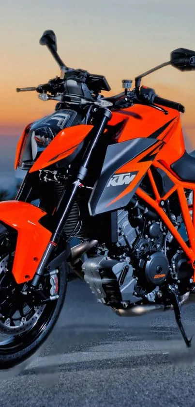 Orange motorcycle against a sunset backdrop, epitomizing speed and adventure.