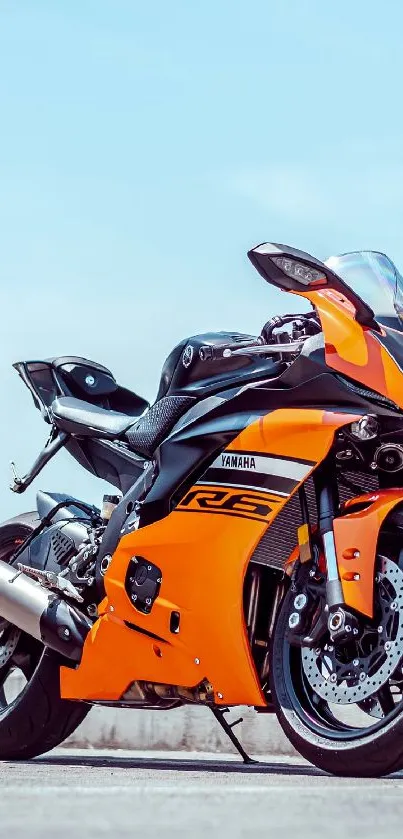 Orange and black motorcycle wallpaper with a sleek sports design.