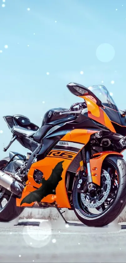 Bright orange motorcycle on a sunny day background.