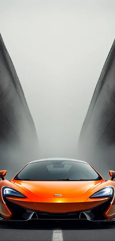 Orange sports car on a dramatic road with fog behind.