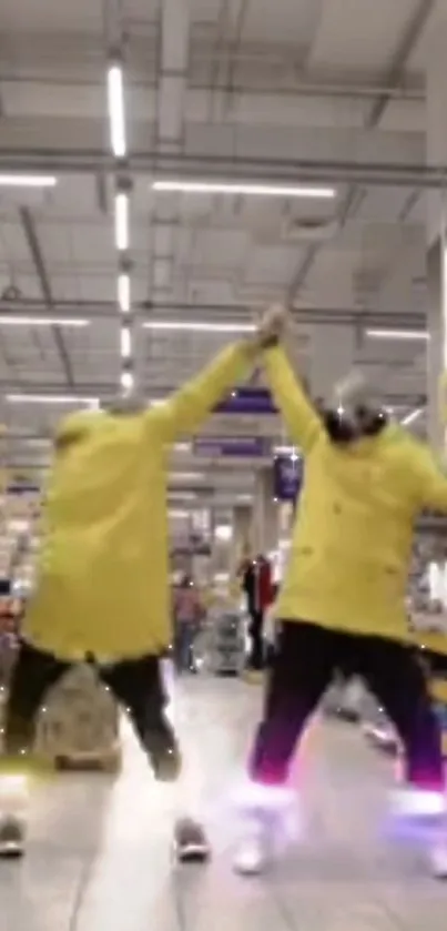 Dynamic duo dancing in yellow coats in an industrial setting.