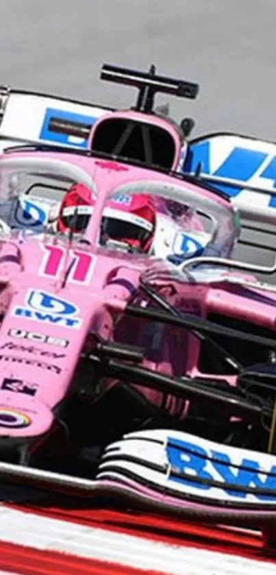 Pink race car speeding on track with vibrant appeal.