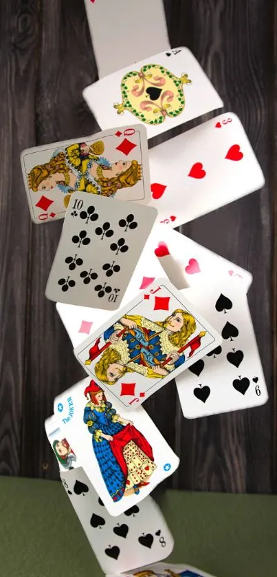 Dynamic cascade of playing cards on a dark wooden background.