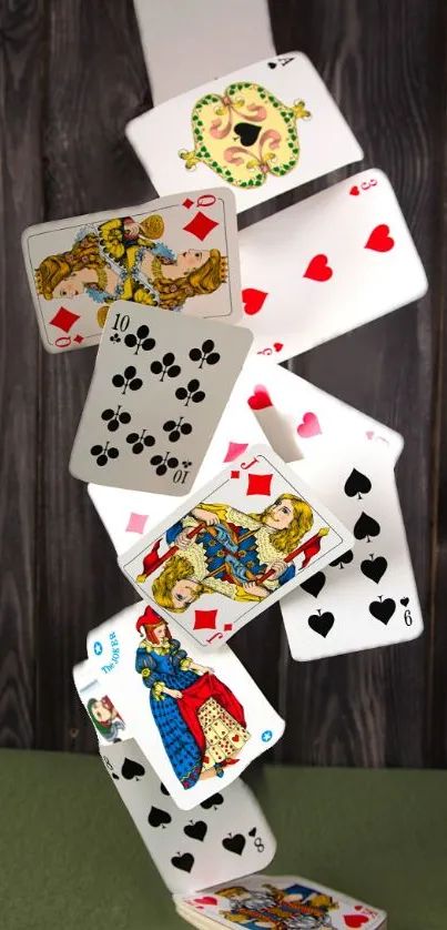 Dynamic cascade of playing cards on a wooden background wallpaper.