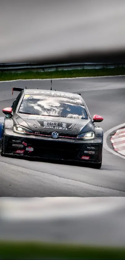 High-speed black racing car on track with vivid motion.