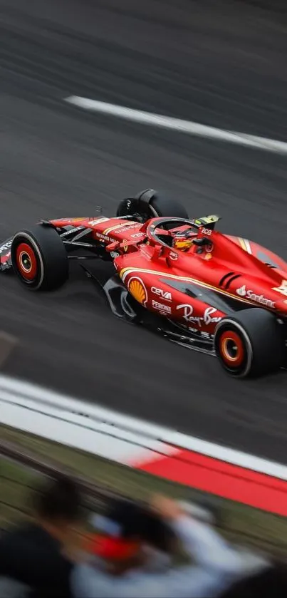 High-speed red racing car zooming on the track.