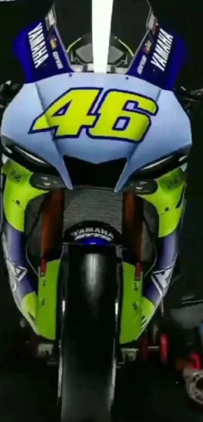 Front view of a racing motorcycle with vibrant blue and yellow design.