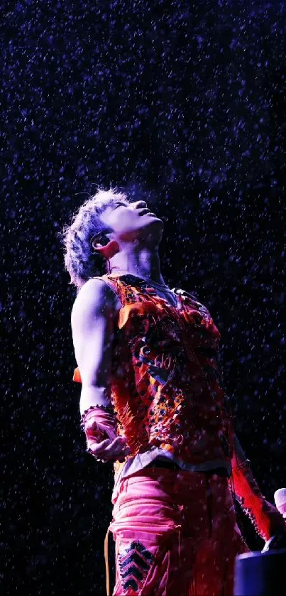 Performer in vibrant rain under dramatic purple lights on stage.