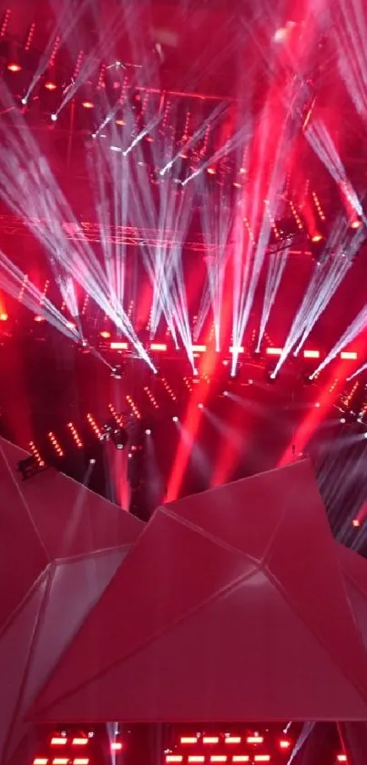 Vibrant red concert lights with dramatic laser effects.