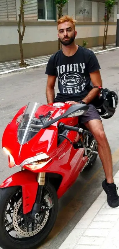 Man on red motorcycle in urban street setting.