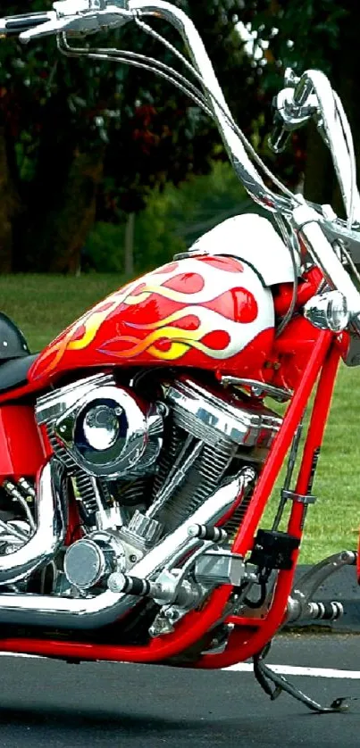 Red motorcycle with chrome accents parked on pavement.