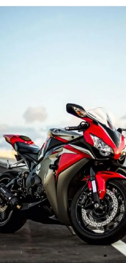 A sleek red sports motorcycle on an open road, capturing speed and adventure.