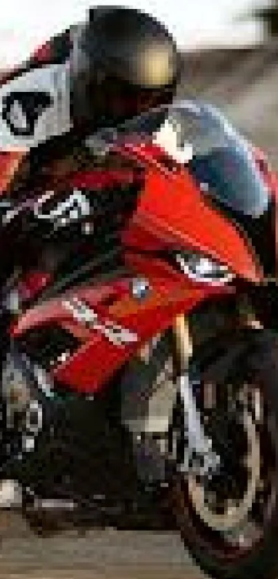 High-speed red motorcycle on a road curve, creating dynamic motion.