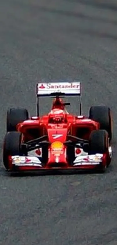 Dynamic red racing car on a track in vibrant motion.