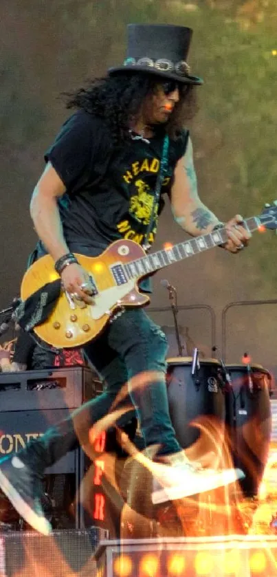 Guitarist performing on a vibrant concert stage with drums and backdrop.