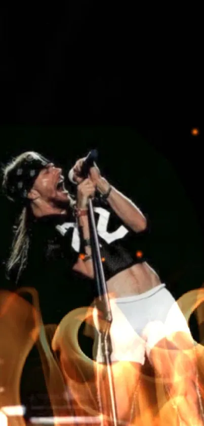 Rock performance wallpaper with energetic stage presence on a black background.