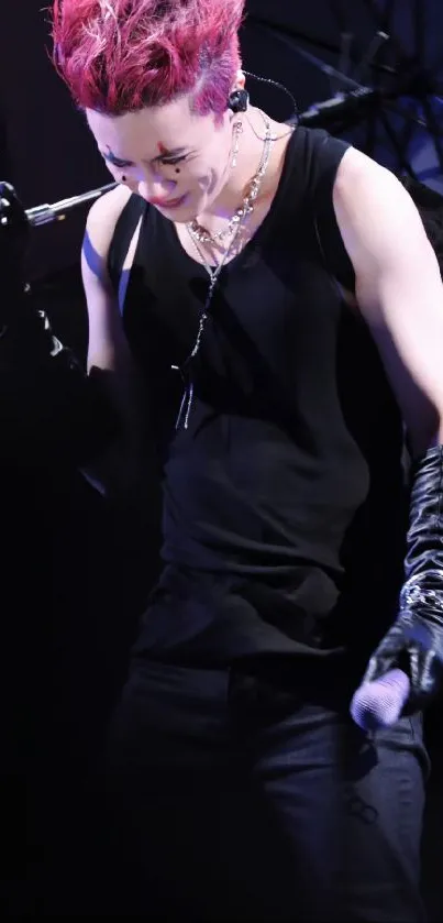 Vibrant rock star on stage with red hair and black outfit.
