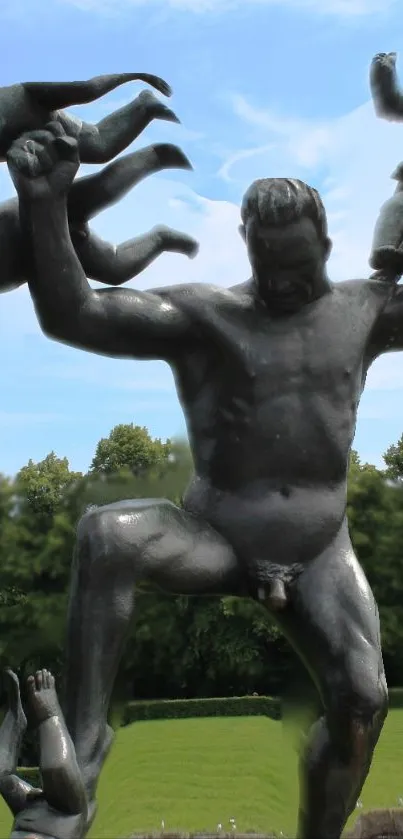 A powerful bronze sculpture set against a lush green and blue natural backdrop.