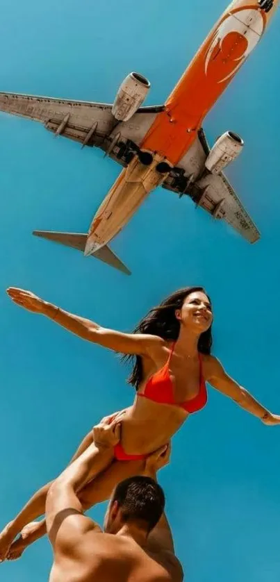 Couple posing under a flying airplane in blue sky.