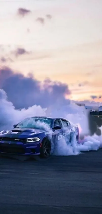 Blue car performing a smoky drift against a sunset background.