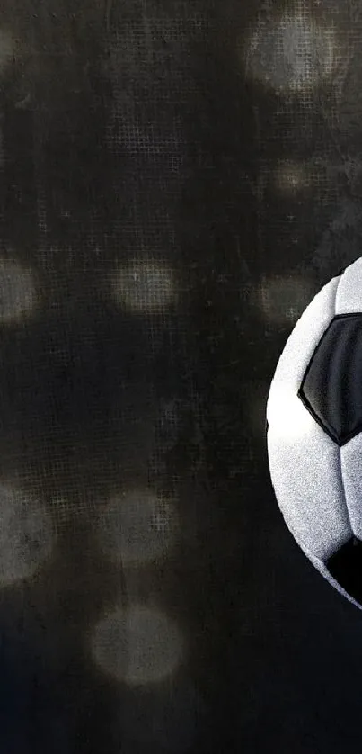 Soccer ball in dark ambiance with stadium lights.