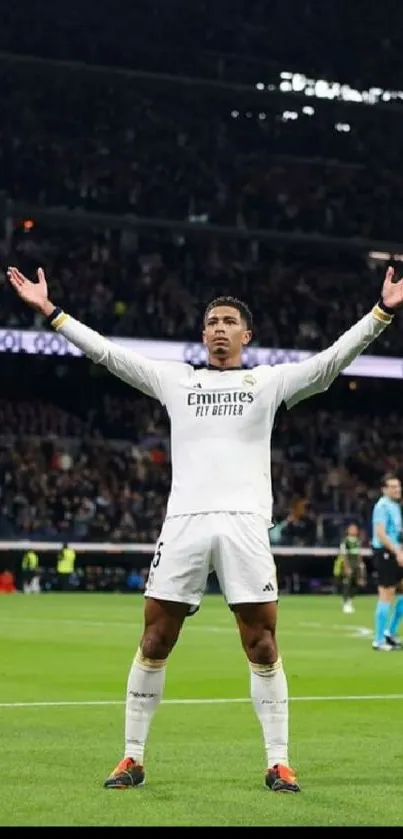 Soccer player celebrating a goal in a packed stadium, arms raised triumphantly.