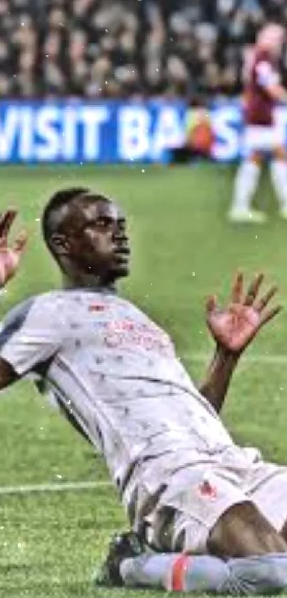 Soccer player celebrating dynamic moment on field wallpaper.