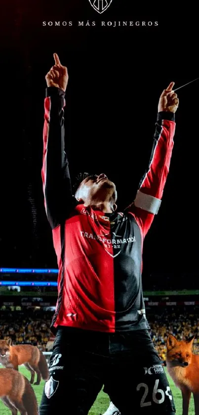 A soccer player celebrates passionately on the field with foxes in the background.