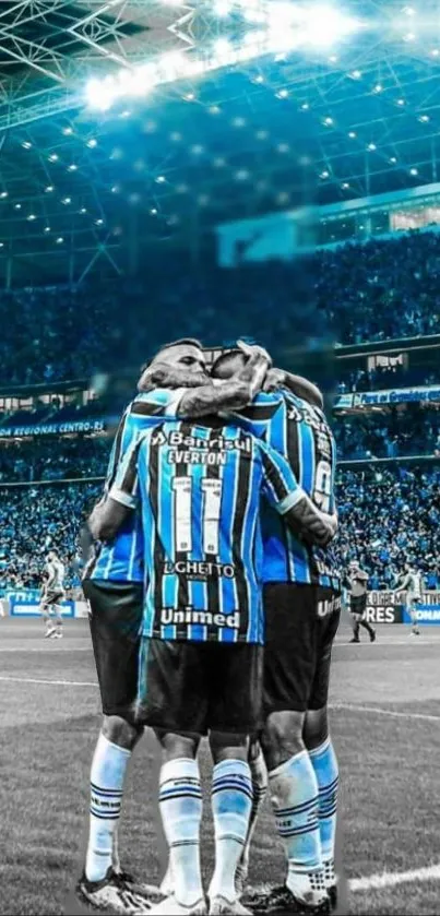 Soccer team huddle on illuminated field in a vibrant, blue-toned stadium.