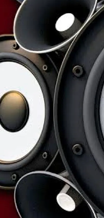 Close-up of stylish black and white speaker design on a deep red background.