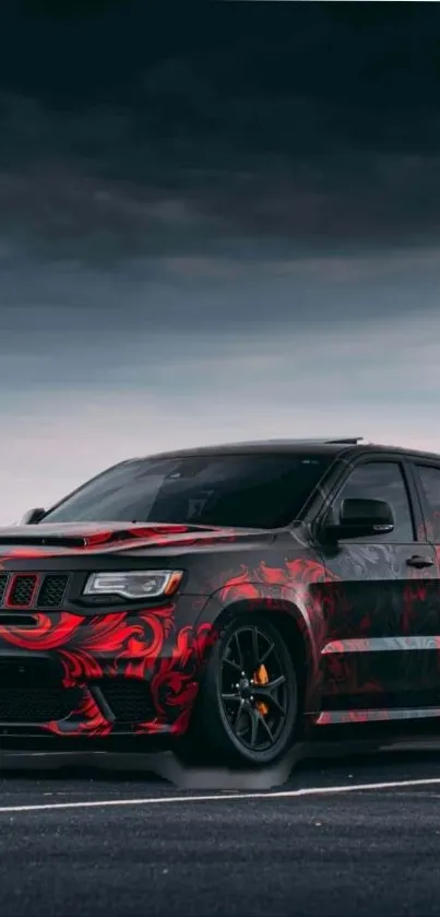 Sleek sports car with red accents under a moody sky