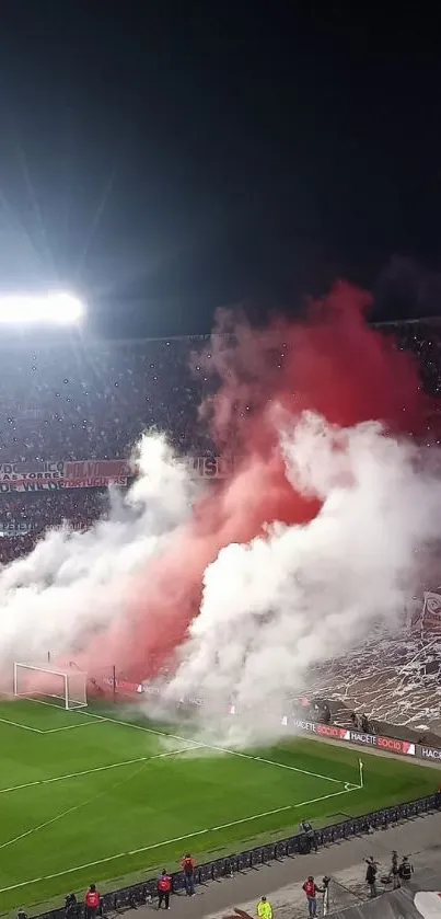 Stadium filled with fans and colorful smoke.