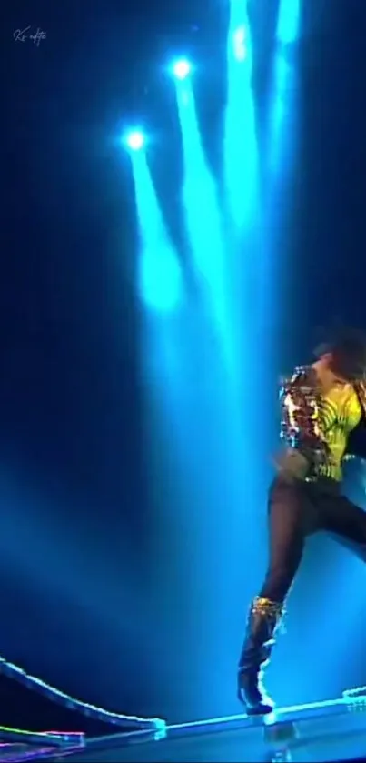 Energetic dancer on stage under vivid blue lights.