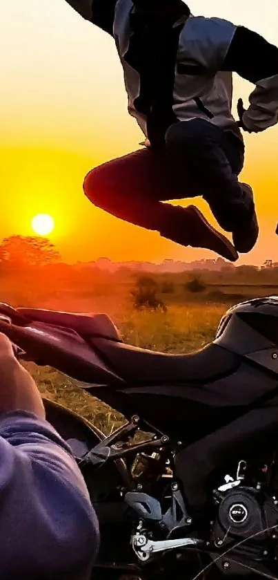 Silhouetted biker jumps over a motorcycle during a vibrant sunset.