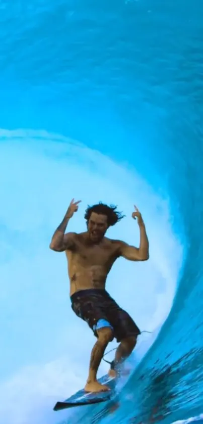 Surfer skillfully riding inside a massive blue wave tube.