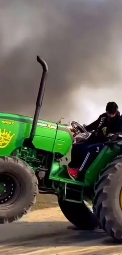 Green tractor performing a wheelie with smoky background.