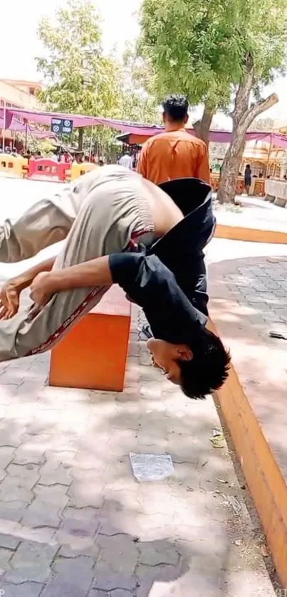 Young man mid-flip in vibrant urban setting with bright orange tones.