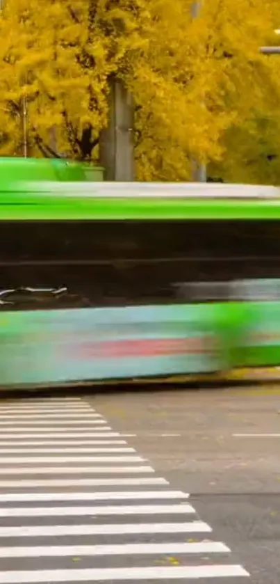 A green bus speeds through a vibrant autumn cityscape.