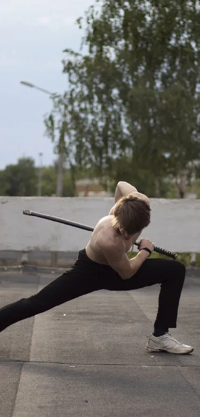 Dynamic urban dancer striking a pose on a rooftop.