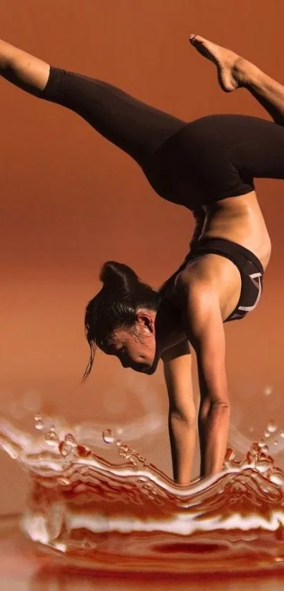 Woman in a yoga pose over a water splash with a copper background.