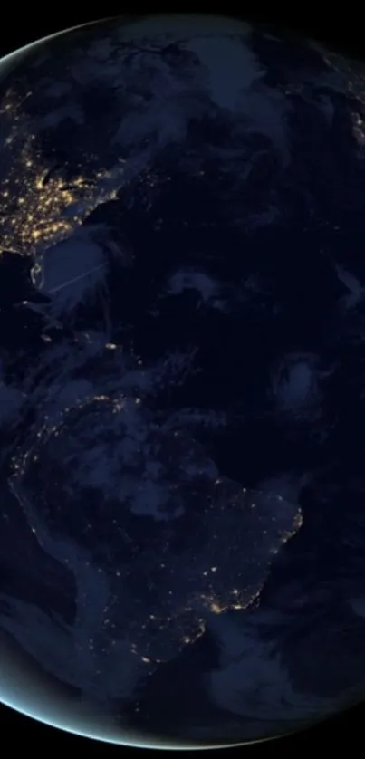 Dark globe of Earth with city lights visible from space at night.