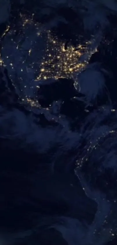 Earth illuminated by city lights against a dark blue backdrop at night.