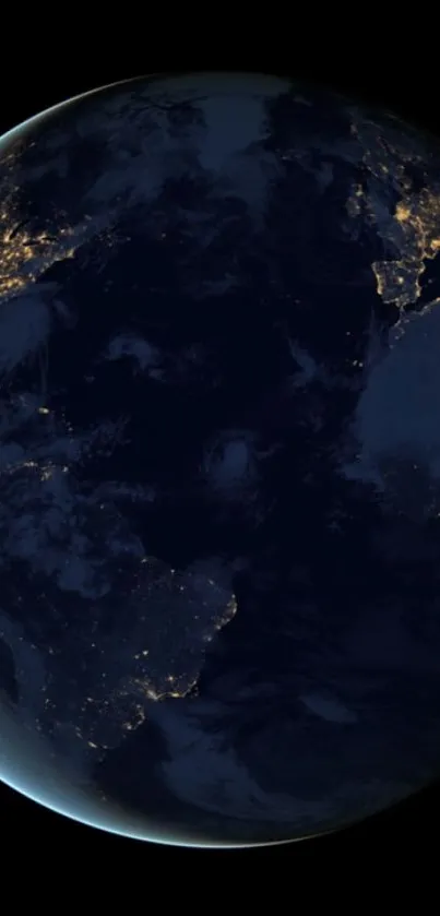 Night view of Earth from space with illuminated city lights.