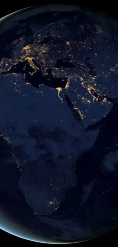 Earth at night with city lights visible from space.